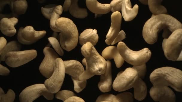 Cashew Nuts Flying Air Free Fall Slow Motion Black Background — Stok Video