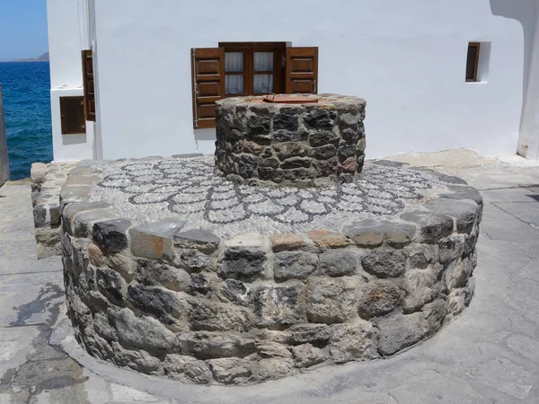 ancient ancient well from a stone with a cover