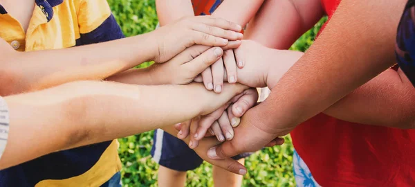 hands of children, many friends, games. Selective focus summer