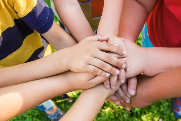 hands of children, many friends, games. Selective focus summer