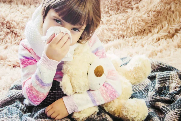 The child is sick and drinks a lot of tea. Selective focus. children.