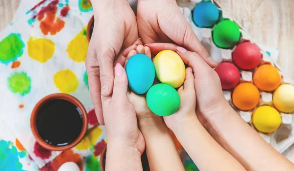 family paints easter eggs. Selective focus. celebration.