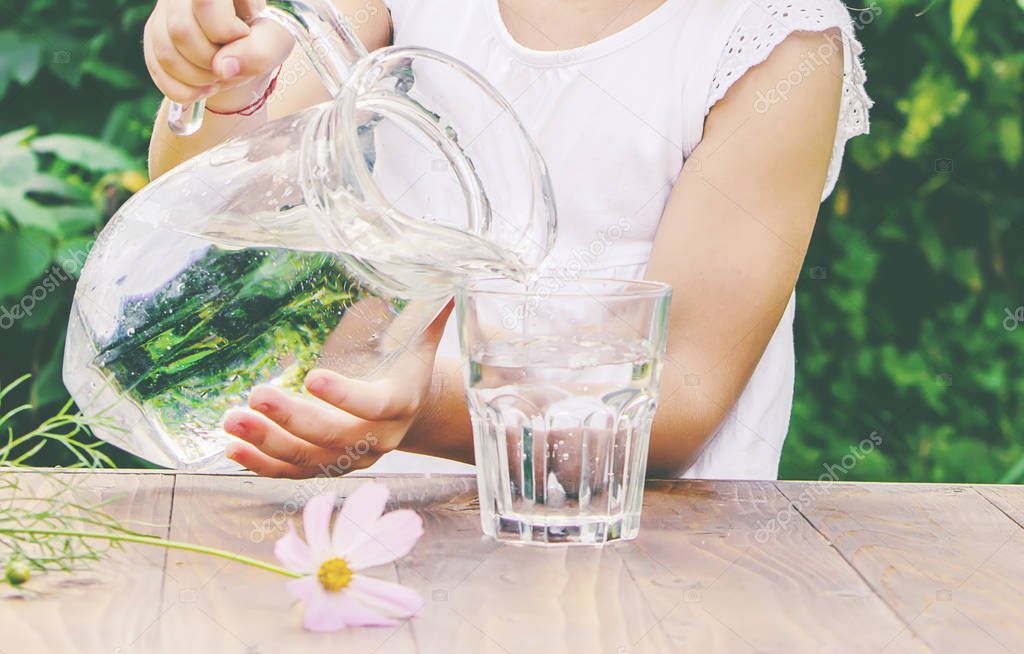 child glass of water. selective focus. nature.