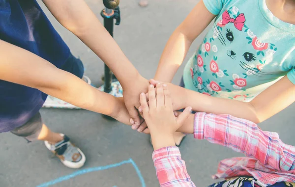 hands of children, many friends, games. Selective focus