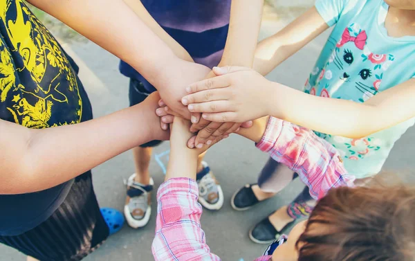 hands of children, many friends, games. Selective focus