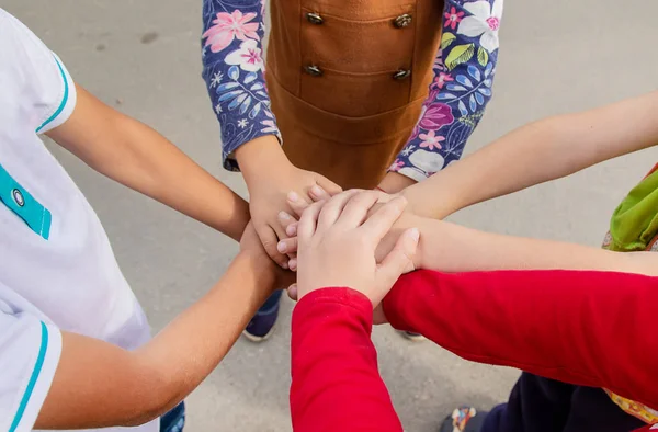 hands of children, many friends, games. Selective focus