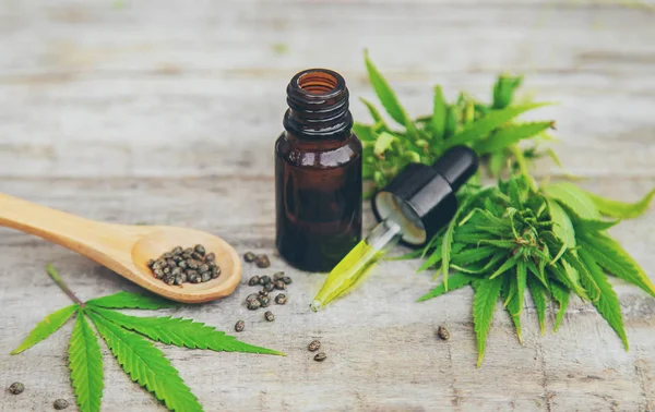 Cannabis oil in a small bottle. Selective focus. — Stock Photo, Image