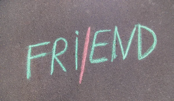 Children's inscription on the asphalt with chalk, friends. Selective focus. — Stock Photo, Image