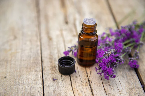 Lavender essential oil in a small bottle. Selective focus.nature.
