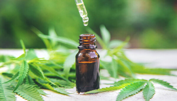 Cannabis extract in a small bottle. Selective focus. nature.