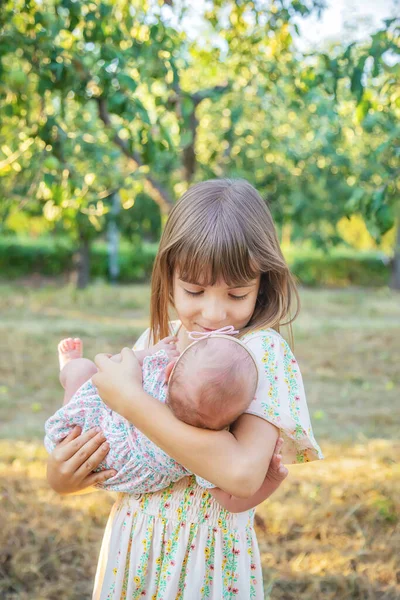 Older Sister Holds Newborn Her Arms Selective Focus People — Stock Photo, Image