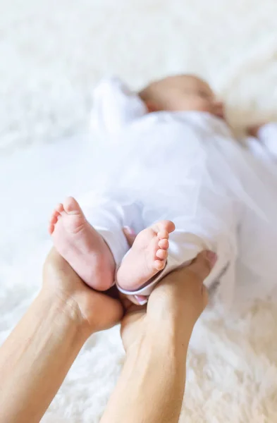 Mom Holds Baby Legs Selective Focus People — Stock Photo, Image