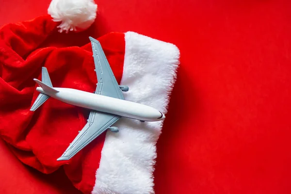 Fondo Navidad Rojo Con Avión Enfoque Selectivo Vacaciones —  Fotos de Stock