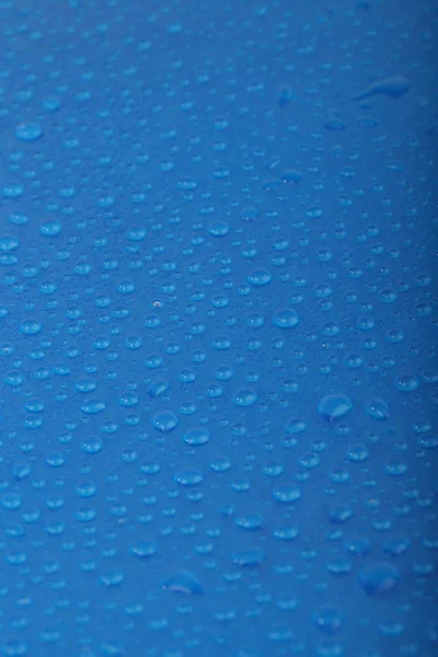 Water drops on blue background. Drops on blue background