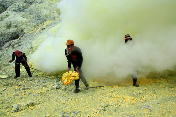 Banyuwangi, East Java, Indonesia, May 27, 2015. Sulfur miners in the Ijen crater. The health condition of miners is very risky because it is not equipped with adequate safety standard equipment.