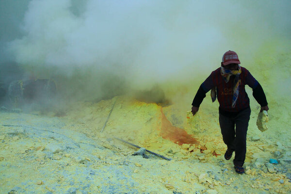 Banyuwangi, Indonesia, May 27, 2015. Sulfur miners in the Ijen crater. The health condition of miners is very risky because it is not equipped with adequate safety standard equipment.
