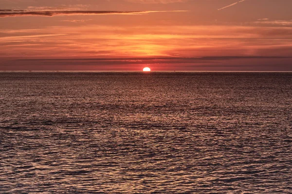 sunset, sea, ocean, sun, water, sky, beach, sunrise, orange, nature, waves, cloud, evening, clouds, horizon, landscape, wave, dusk, beautiful, reflection, light, blue, beauty, dawn