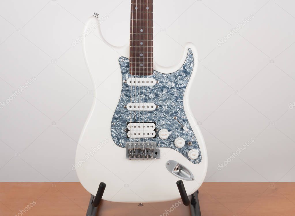 Part of white electric guitar, studio shoot.  2 x Single Coil an