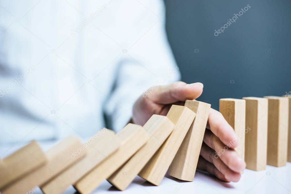 Problem Solving Businessman Stopping Falling Blocks