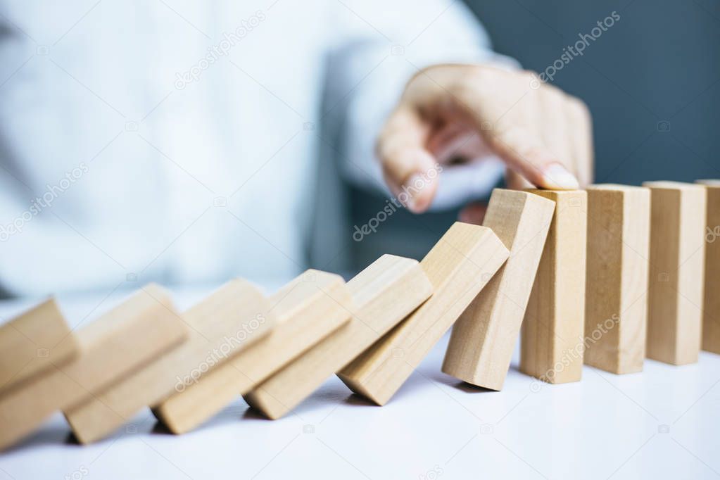 Problem Solving Businessman Stopping Falling Blocks