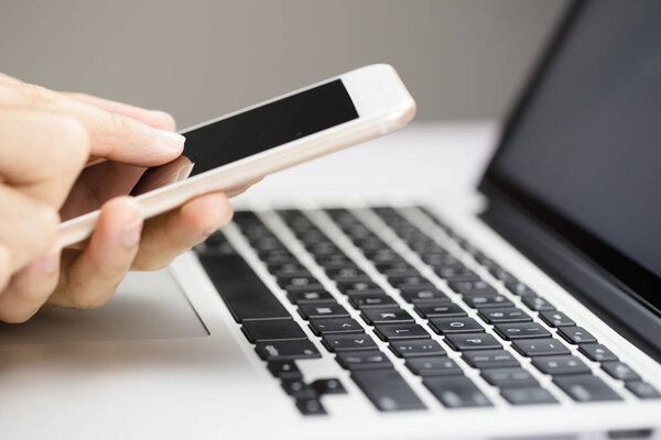 Businessman Using Smartphone And Laptop