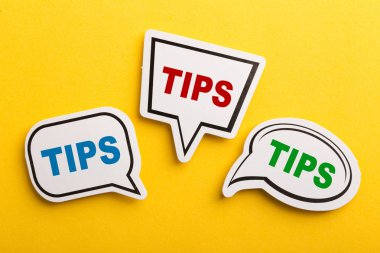 Tips Speech Bubble Isolated On Yellow Background