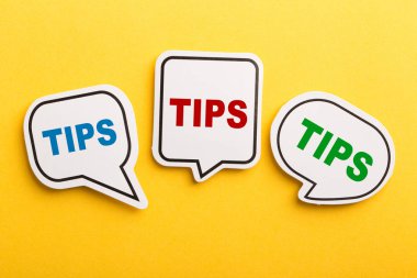 Tips Speech Bubble Isolated On Yellow Background