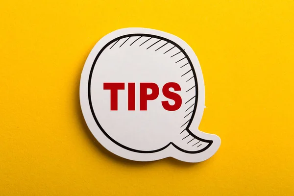 Tips Speech Bubble Isolated On Yellow Background — Stock Photo, Image