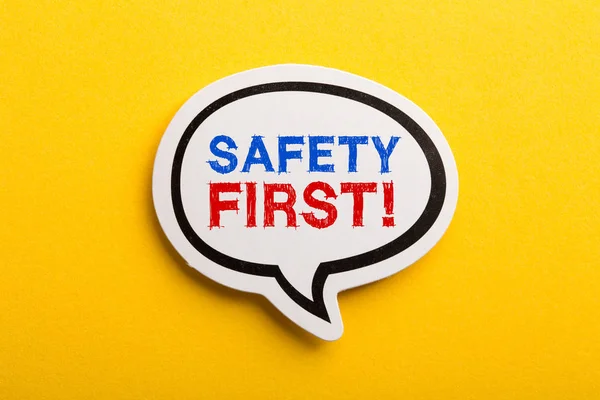 Safety First Concept Speech Bubble Isolated On Yellow — Stock Photo, Image