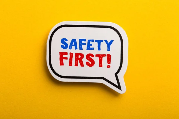 Safety First Concept Speech Bubble Isolated On Yellow — Stock Photo, Image