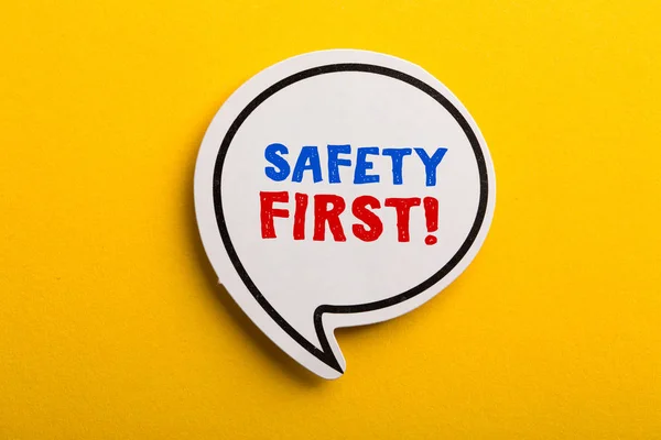 Safety First Concept Speech Bubble Isolated On Yellow — Stock Photo, Image