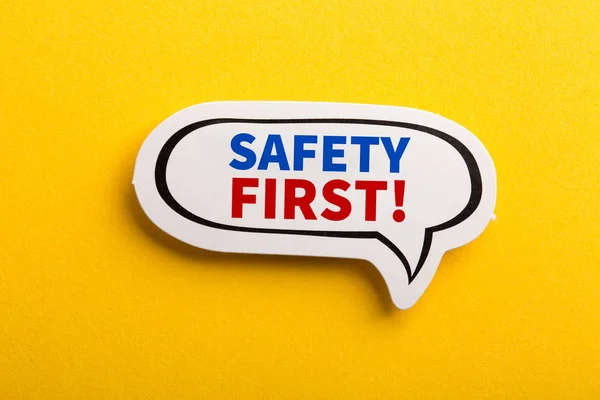 Safety First Concept Speech Bubble Isolated On Yellow — Stock Photo, Image