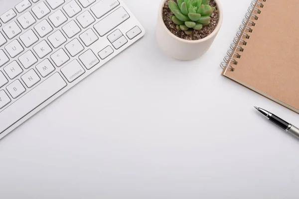 stock image White office desk table with computer keyboard and other office supplies. Top view with copy space, flat lay.