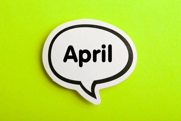 April Speech Bubble Isolated Yellow Background — Stock Photo, Image