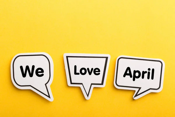 April Speech Bubble Isolated Yellow Background — Stock Photo, Image