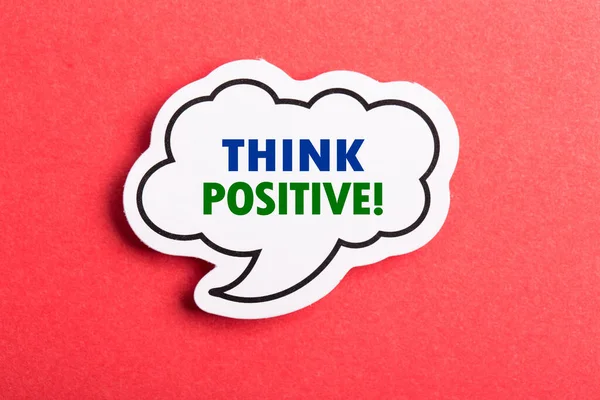 Think Positive speech bubble isolated on the red background.