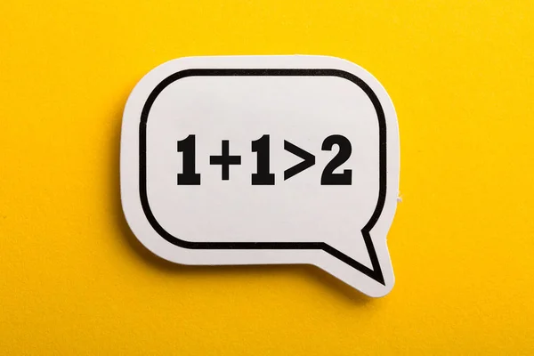 Synergy One One More Two Speech Bubble Isolated Yellow Background — Stock Photo, Image