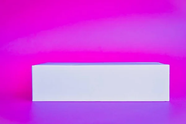 stock image Abstract empty rectangle. The podium in a bright pink neon light stage background for minimum of this content of the advertising banner layout design of the product.