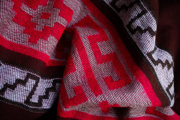 Argentinian colourful poncho gaucho. Warm and cozy. Pattern close up, textile background.