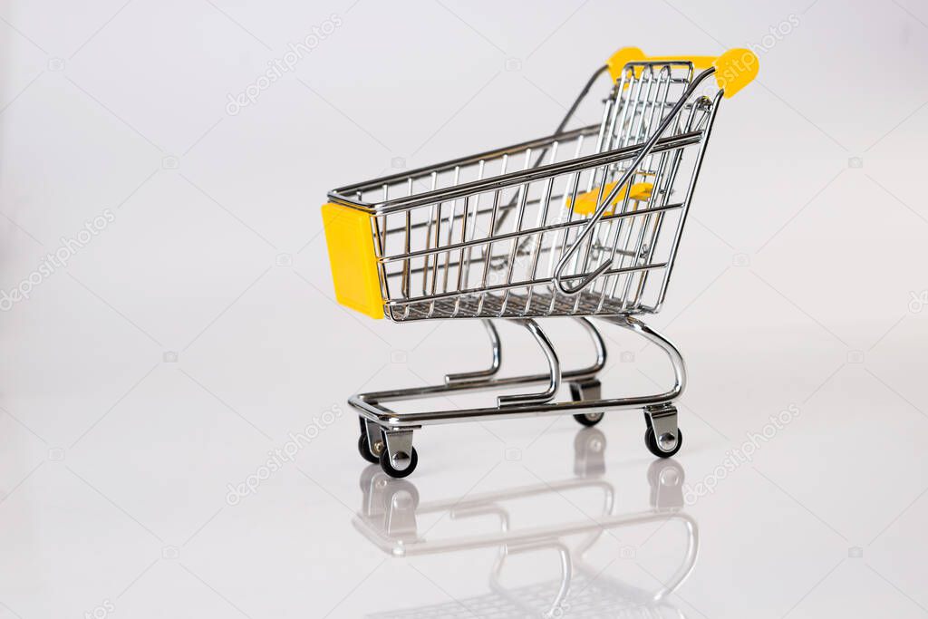 Side view of empty trolley with reflection on white background