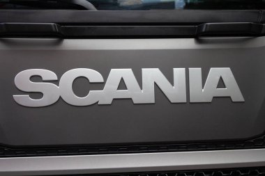 Kiev, Ukraine - June 08, 2018: Logotype of the truck Scania on the car cabin clipart