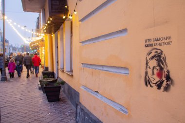 Kiev, Ukraine - December 30, 2018: Graffiti on the wall of Kiev street with a portrait of a murdered activist with the words 