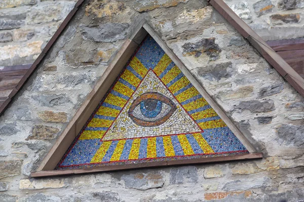 All-seeing eye of God - a mosaic of wall background medieval church. Eye of Providence