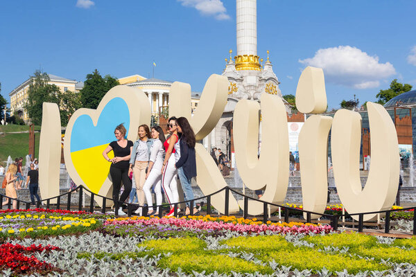 Kiev, Ukraine - May 25, 2018: People on the Independence Square at the installation "I love Kiev" in Ukrainian