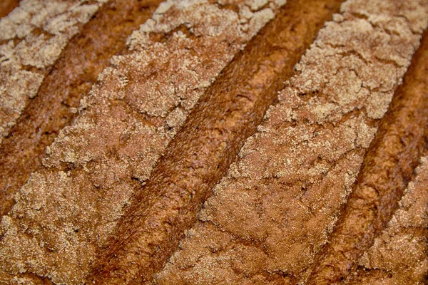 Pan recién horneado con un primer plano corteza. Fondos y texturas —  Fotos de Stock