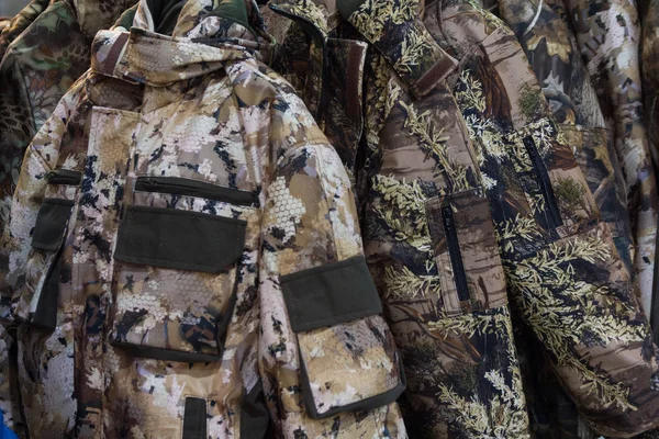 Samples camouflage military clothes in the store