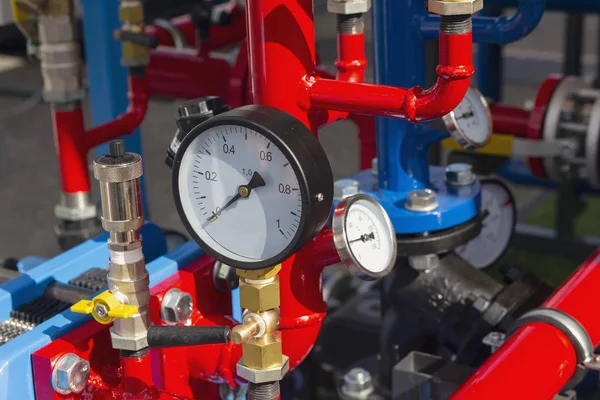 Equipment of the boiler-house, - valves, tubes, thermometer close up