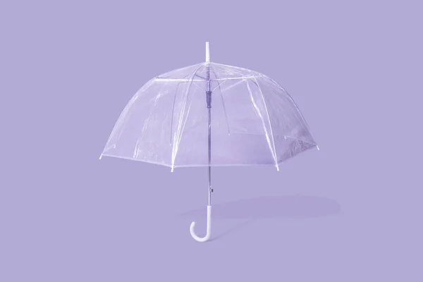 Ombrello viola su sfondo viola — Foto Stock