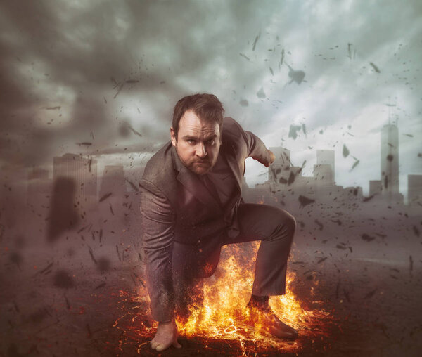 Superhero businessman concept with fire and city background