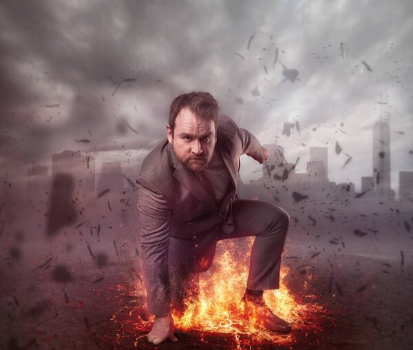 Superhero businessman concept with fire and city background